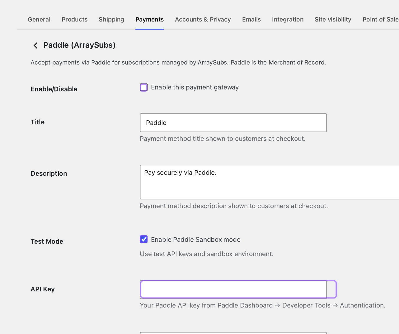 Annotated Paddle gateway settings showing enablement, Sandbox mode, and a blank API Key field.